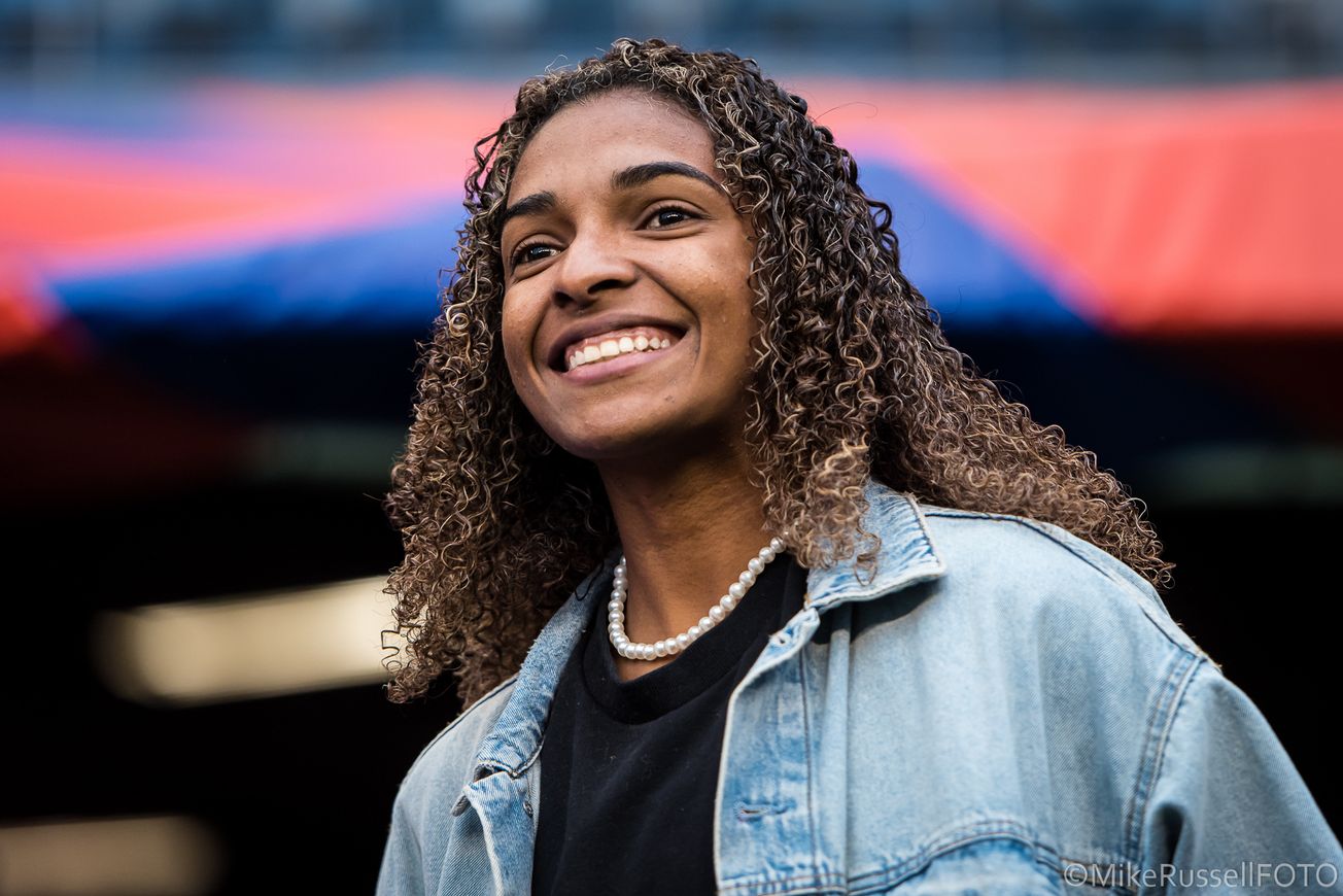 OL Reign midfielder Luany in street clothes ahead of a Reign / San Diego Wave FC game in April 2023.