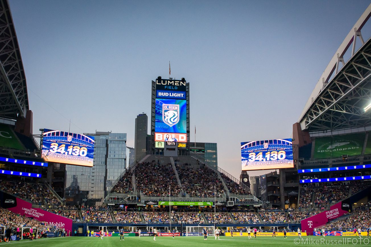Shot of the north end of Lumen Field with two video boards displaying 34,130, a NWSL single-match attendance record.