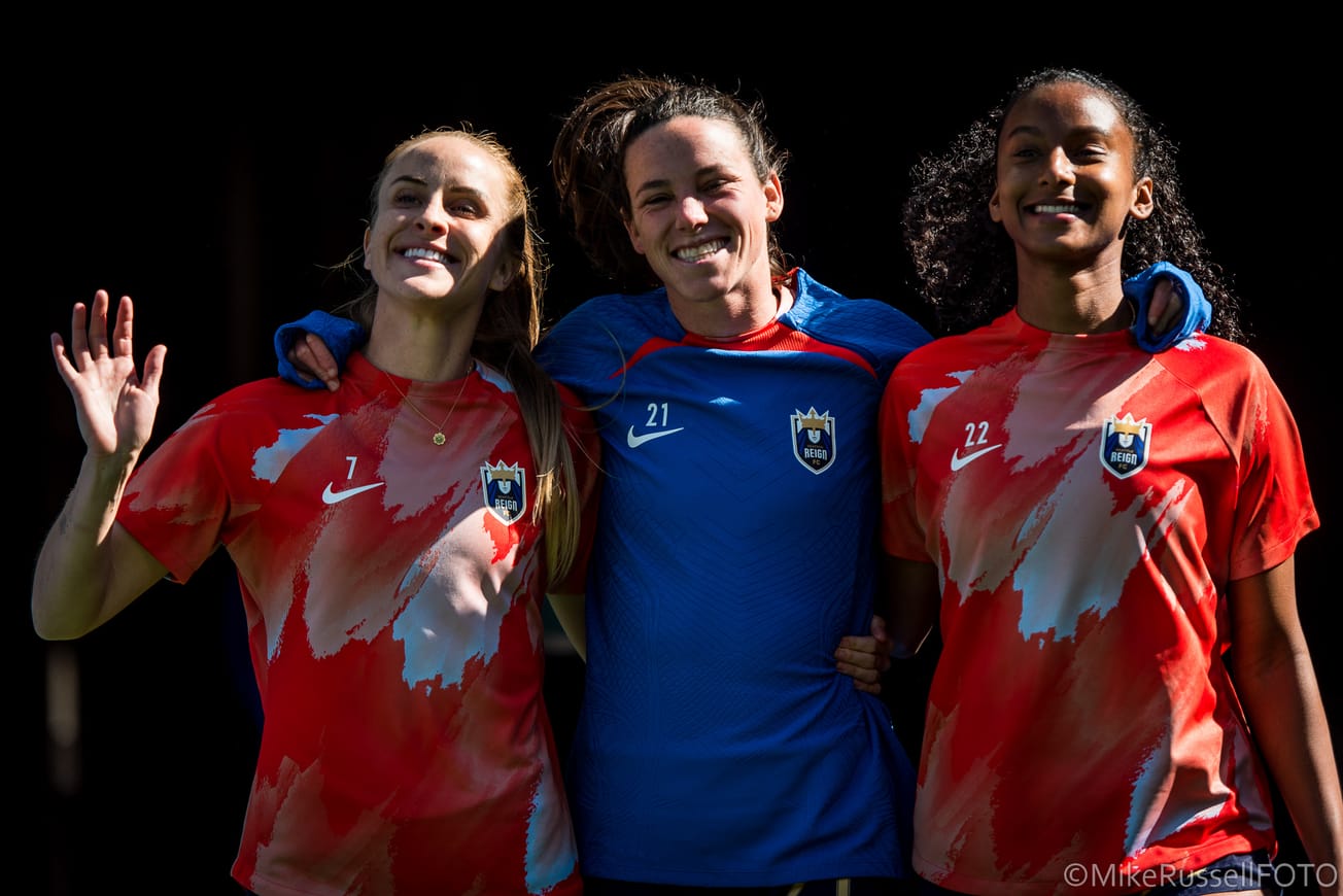 Defender Phoebe McClernon (middle) walks alongside teammates Nikki Stanton (left) and Ryanne Brown (right)