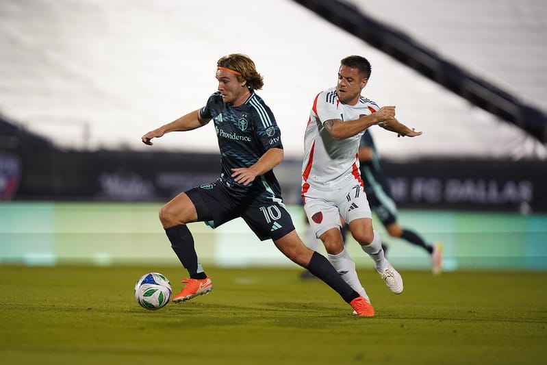 Pedro de la Vega dribbles past a Dallas defender in a April 2025 game