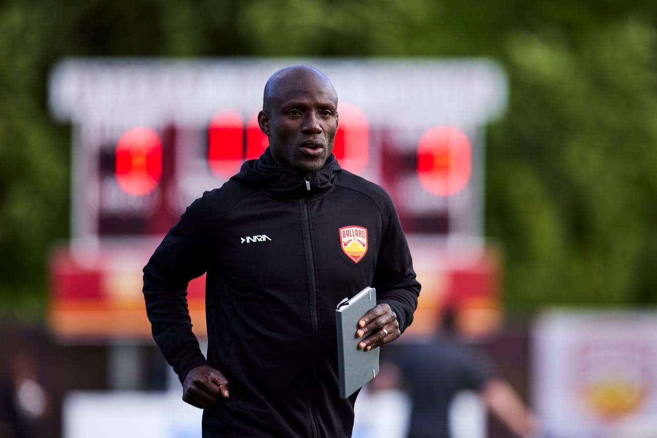 New Ballard FC Head Coach Mutanda Kwesele on the field at a 2025 match against Bigfoot FC