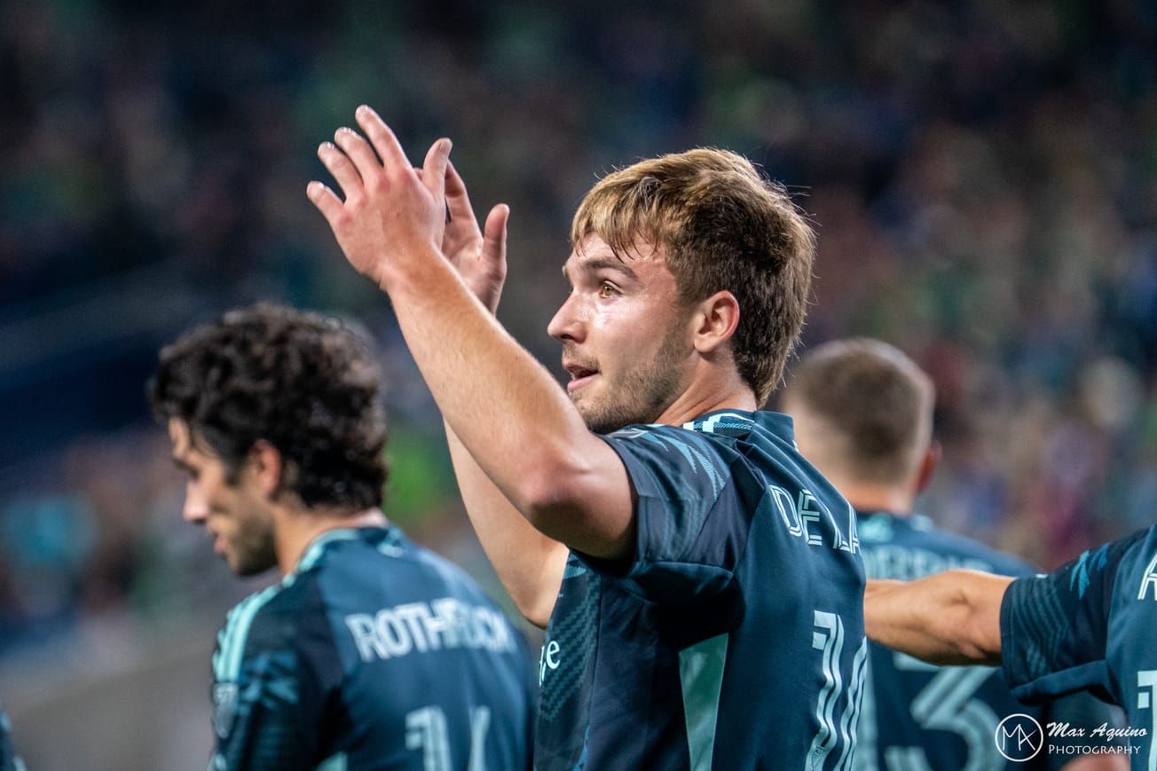 Pedro de la Vega in a blue Seattle Sounders jersey celebrating his goal.