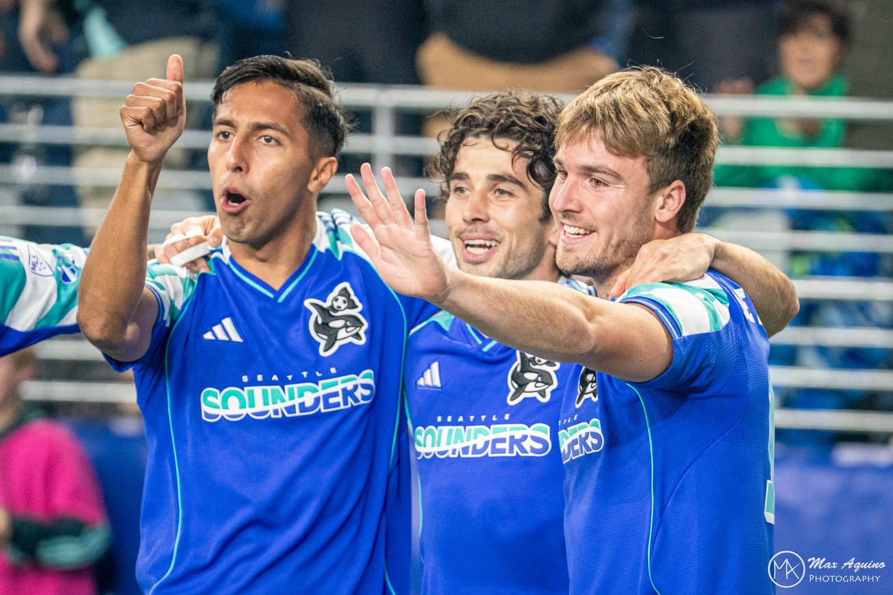 Danny Leyva, Paul Rothrock and Pedro de la Vega celebrate a go