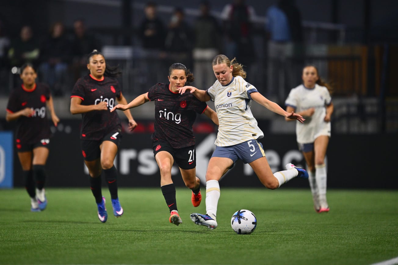 Reign fall to Portland despite two-player advantage